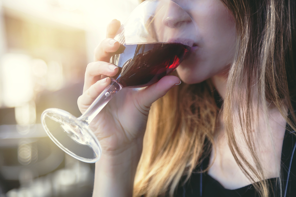 Woman drinking rose wine
